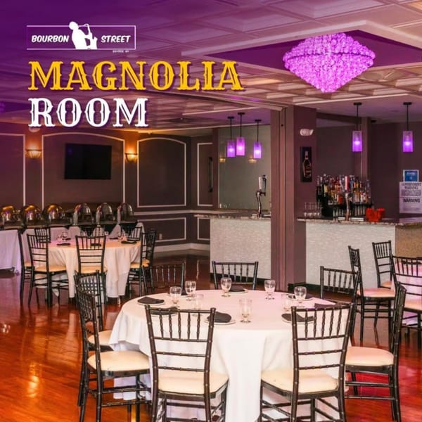 The Magnolia Room at Bourbon Street, featuring set tables, a buffet, and a bar area with purple lighting.